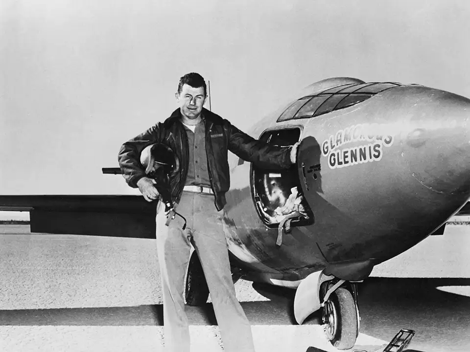 Chuck Yeager and X-1 aircraft 'Glamorous Glennis' on tarmac.