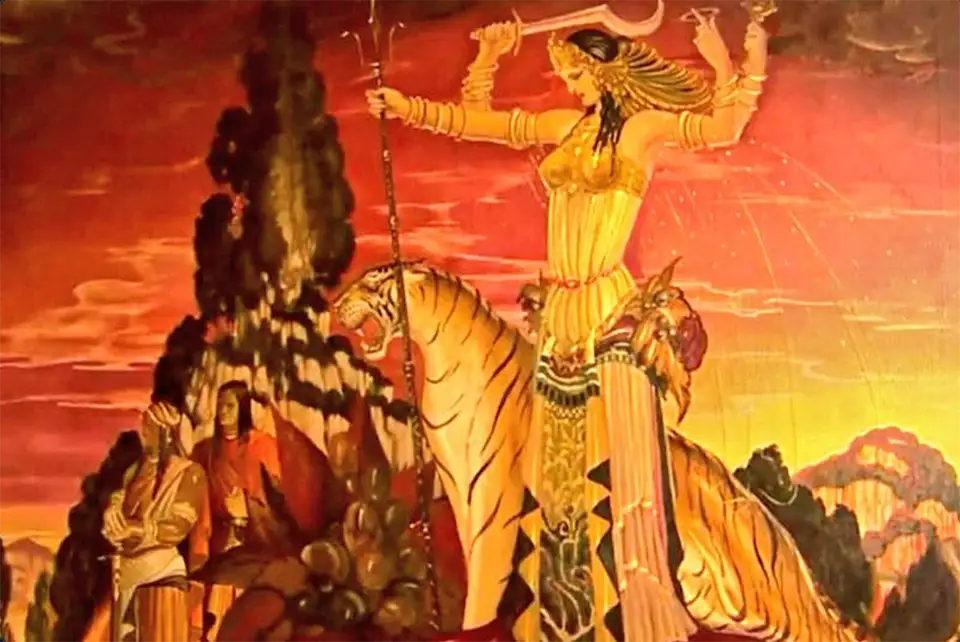 Goddess Durga riding tiger, holding sword and trident.