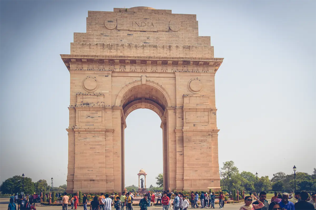 India Gate monument in New Delhi with many people.